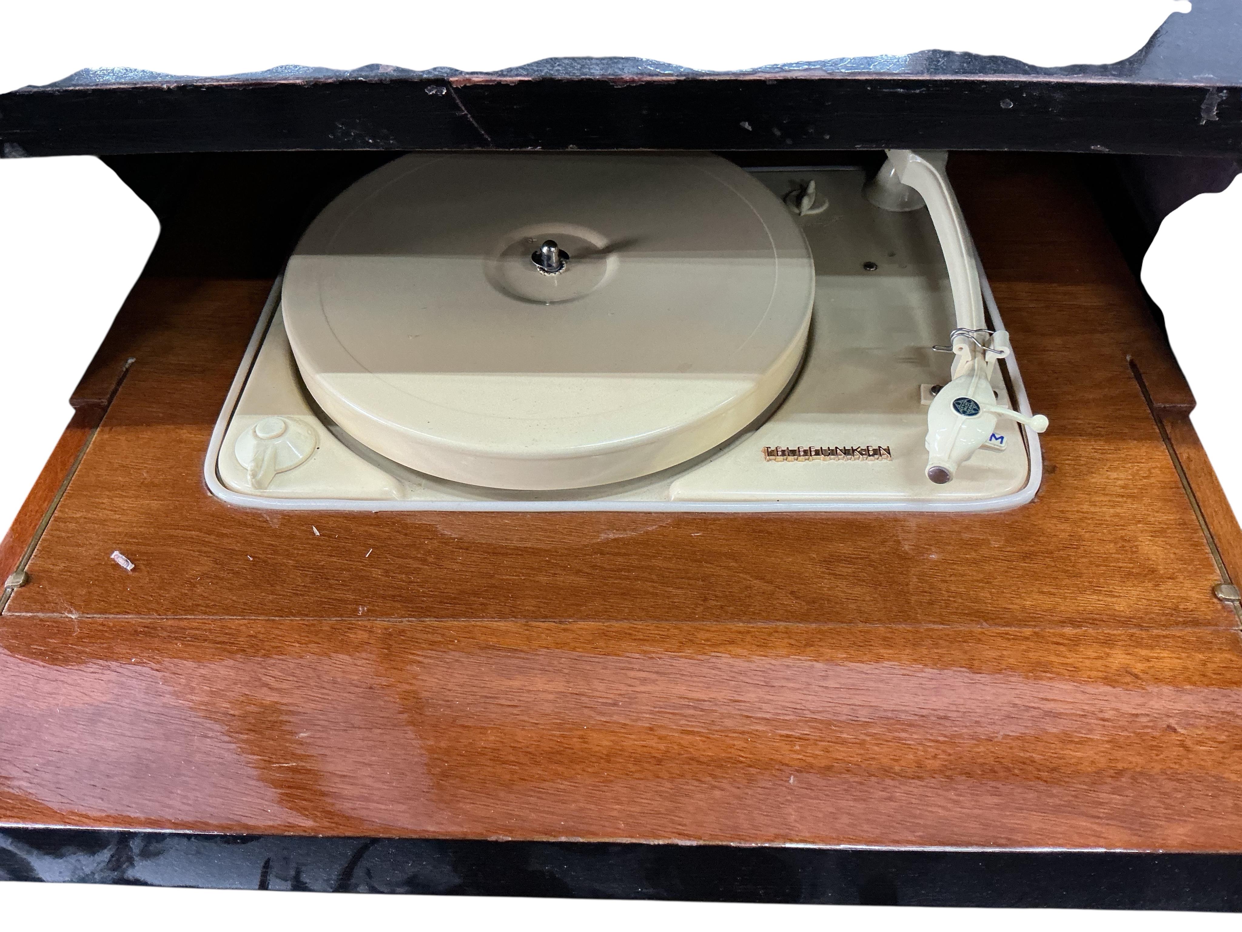 A mid century ebonised Telefunken record player with booklet, width 62cm, depth 43cm, height 68cm